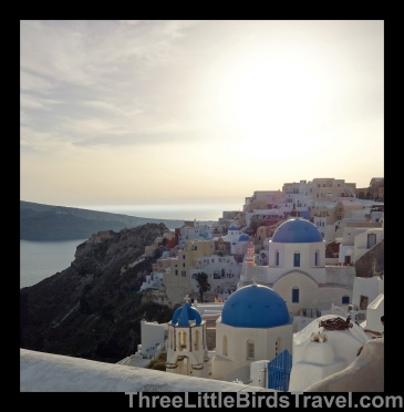 Find the blue domed buildings in Oia - Santorini, Greece